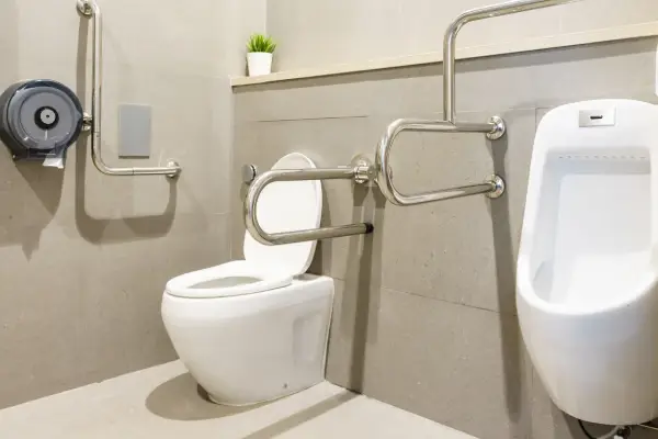 Interior of bathroom for the disabled or elderly people. Handrail for disabled and elderly people in the bathroom